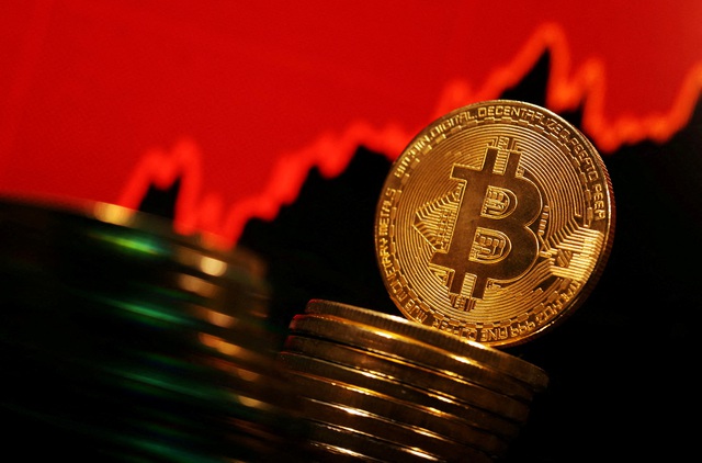 Bitcoin vượt mốc 60.000 USD, tiến gần kỷ lục- Ảnh 1.