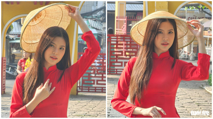 Bạn trẻ chụp hình cùng áo dài đỏ truyền thống với nón lá tại lăng Ông - Ảnh: NHẬT XUÂN