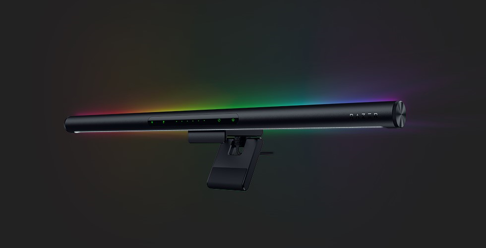 A black object with a rainbow colored lightDescription automatically generated